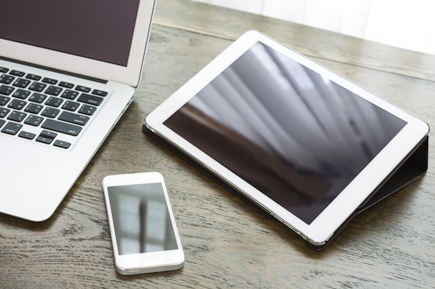 Close-up of technological devices on wooden desk Free Photo