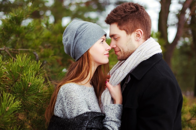 Closeup Of Young Woman Grabbing Her Boyfriends Scarf Photo Free