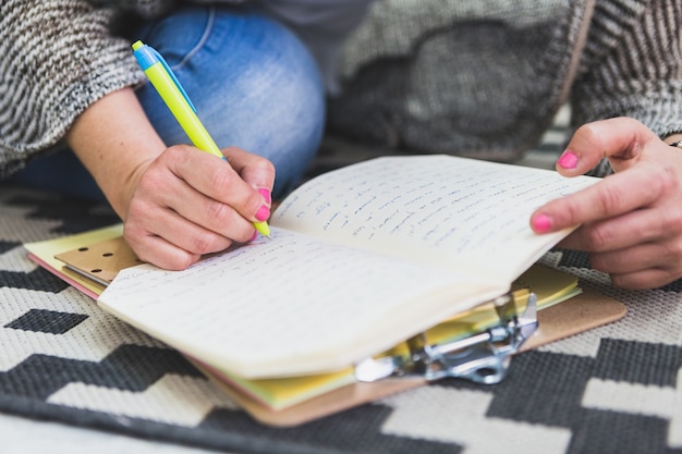 Free Photo | Close-up Of Person Writing In A Notebook