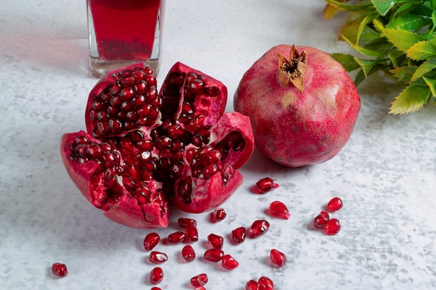 Free Photo | Close up photo of fresh sliced pomegranate sliced or whole.