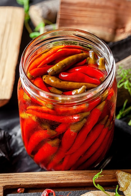 Premium Photo | Close up on pickled red chili peppers in jar