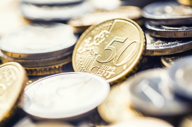 Premium Photo | Close-up a pile of new euro coins in other compositions.