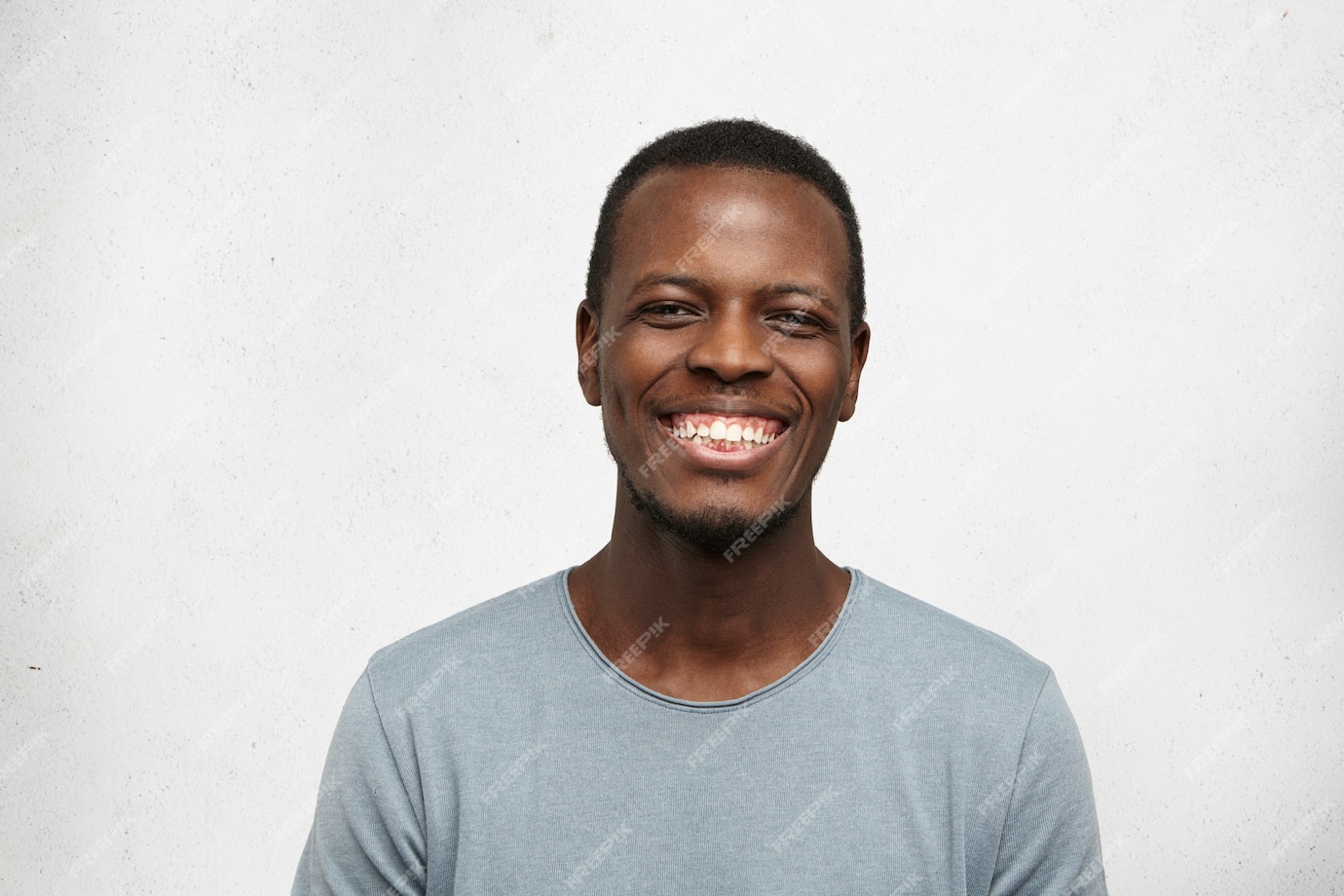 Free Photo | Close up portrait of cheerful young black man in grey t ...