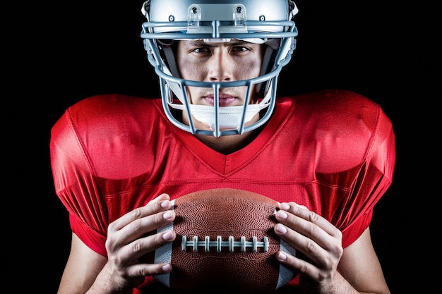 Premium Photo Close Up Portrait Of Confident American Football Player Holding Ball