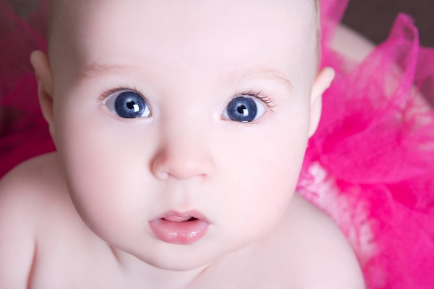 Premium Photo | Close up portrait of funny baby girl with big eyes