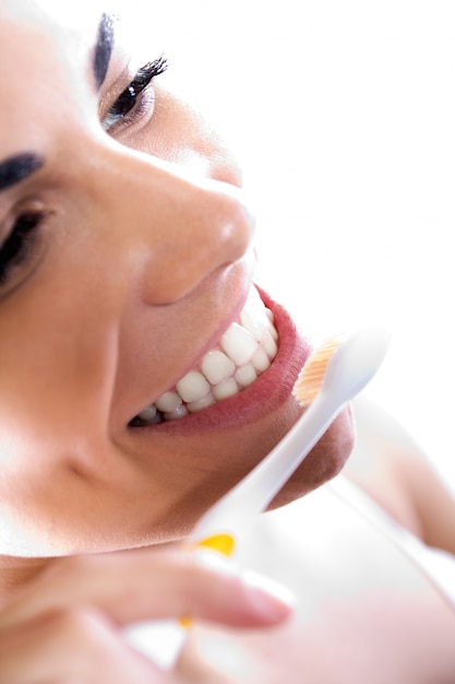 Close up portrait of beautiful young woman picking his teeth Free Photo