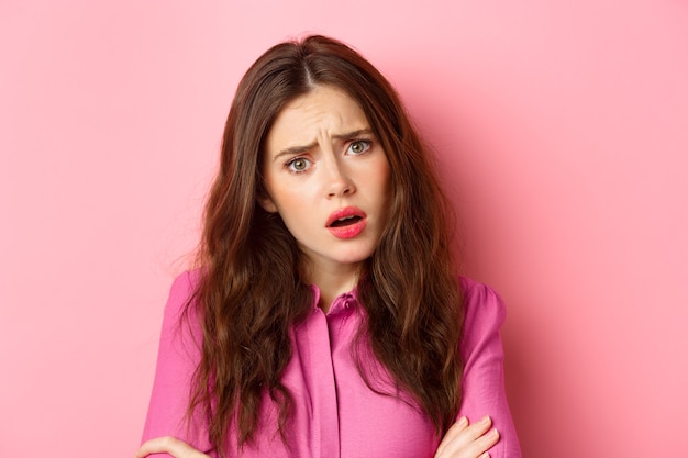 Premium Photo | Close up portrait of sad young woman hear upsetting ...