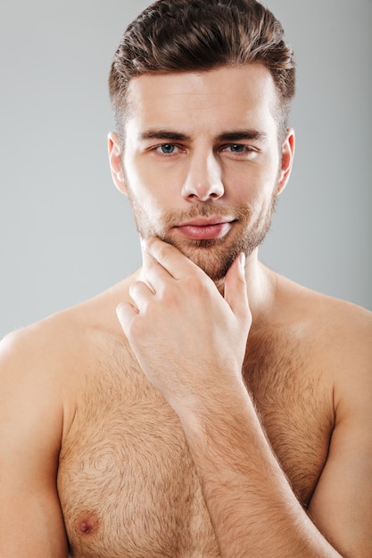 Close Up Portrait Of Half Naked Bearded Man Looking At 