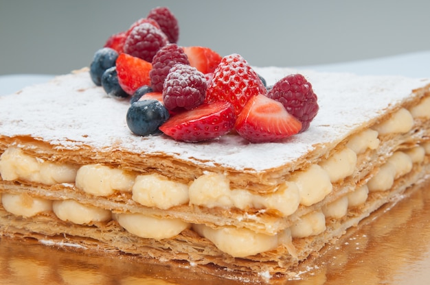 Close Up Of Puff Pastry Layer Cake Decorated With Fresh Berries