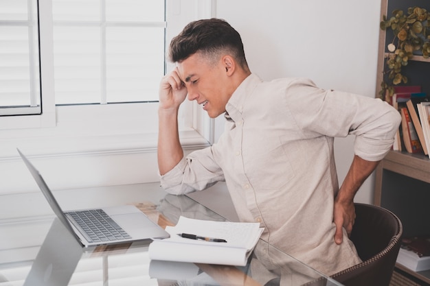 Premium Photo | Close up rear view stressed young man touching lower ...