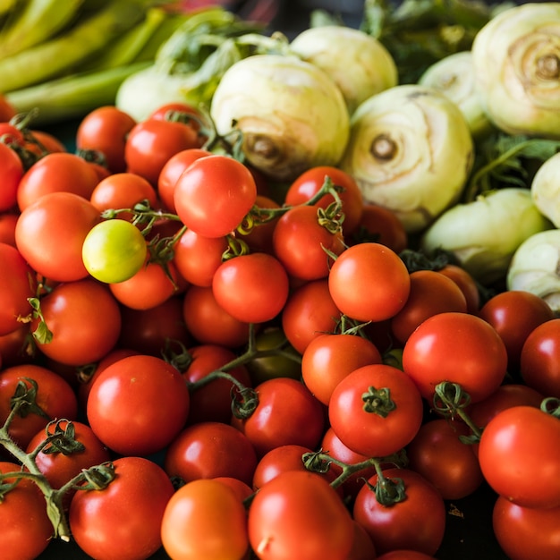 Free Photo Closeup of red tomatoes for sale in the market