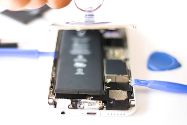 Premium Photo | Close-up of repairing cellphone, inside of the phone