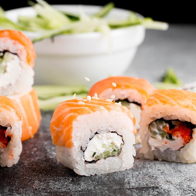 Free Photo Close-up Salad And Fresh Sushi Rolls