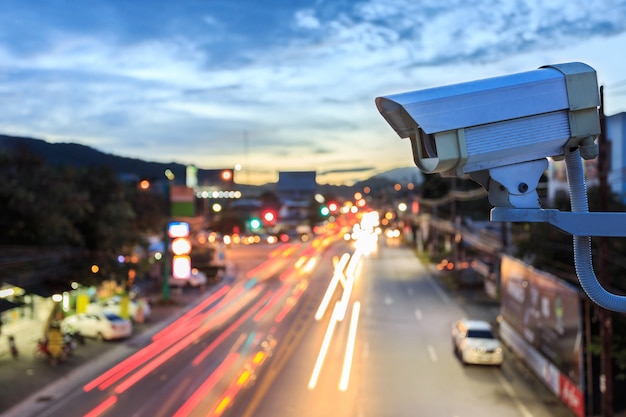 Close up security cctv camera operating over the road | Premium Photo