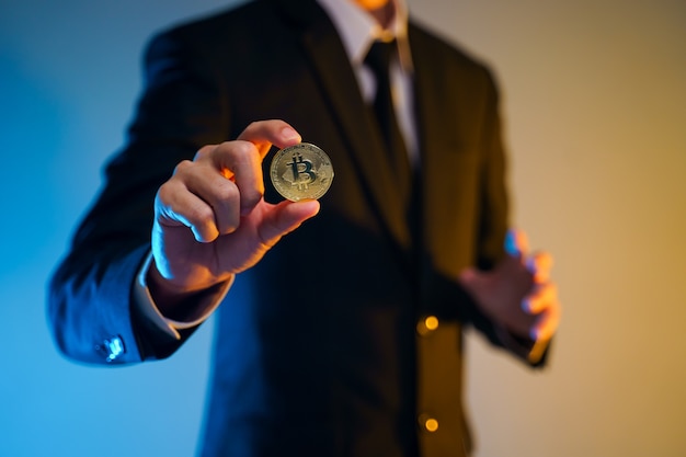 Premium Photo | Close up shot of businessman in black suit holding