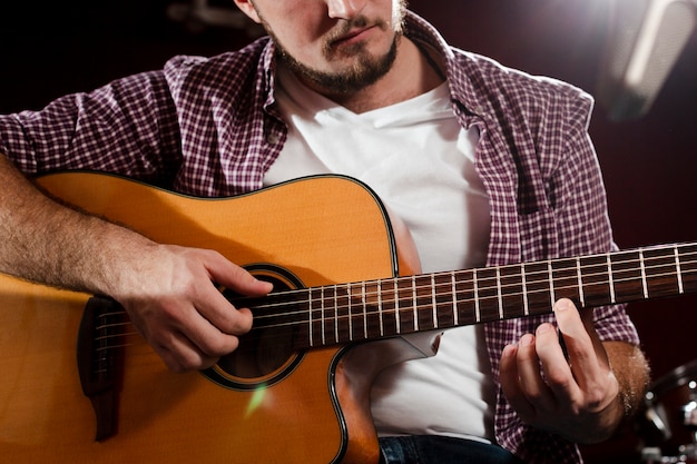 Free Photo Close Up Shot Of Guy Playing Guitar