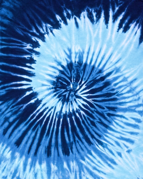 Close up shot of spiral blue tone color tie dye fabric texture ...