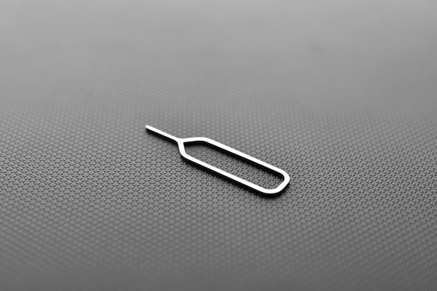 Premium Photo | Close up of sim card ejector tool