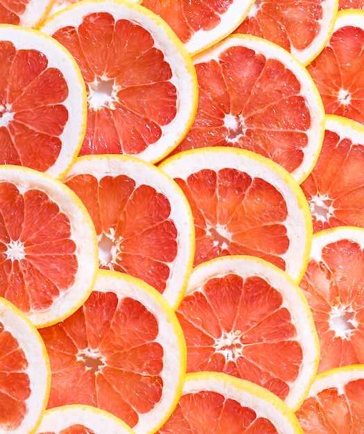 Premium Photo | Close up of sliced grapefruit as a background