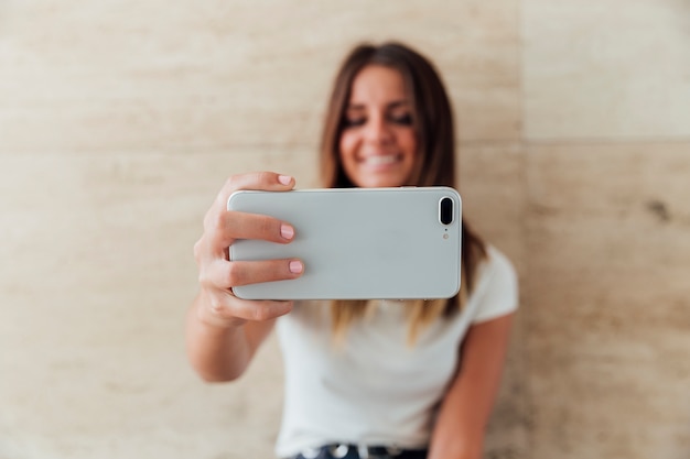 Premium Photo | Close-up smiley girl taking a selfie