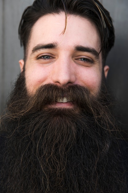 Free Photo | Close-up of a smiling young bearded man