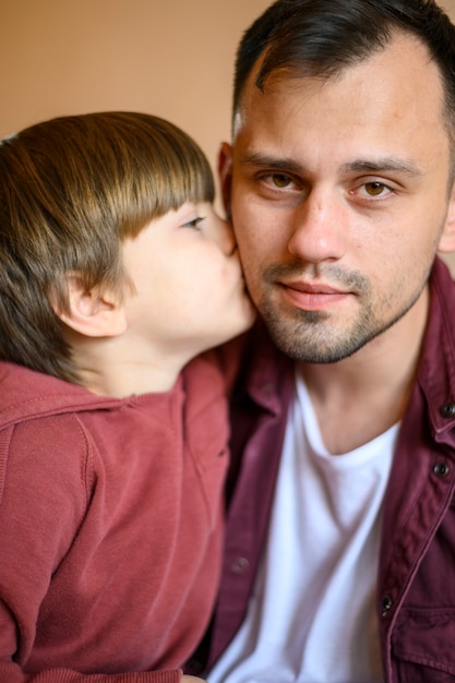 Free Photo Close Up Son Kissing Father