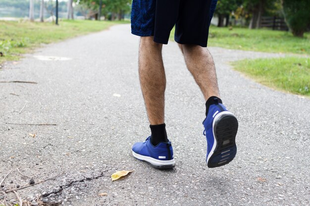 Premium Photo | Close up of sport man running in the morning. workout ...