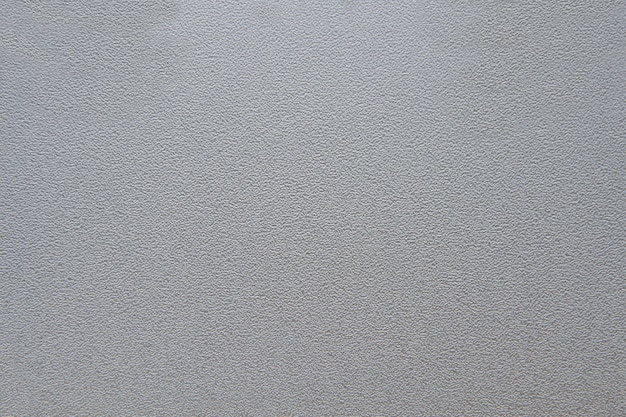 A closeup of the surface of gray sheet background,texture of wallpaper color backgrounds Photo