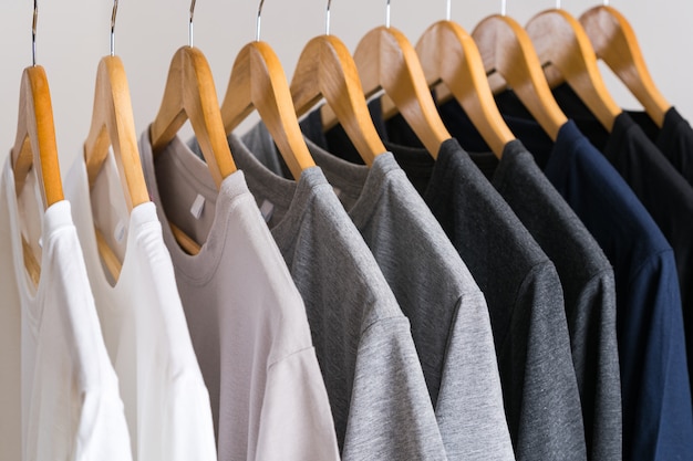 Premium Photo | Close up of t-shirts on hangers