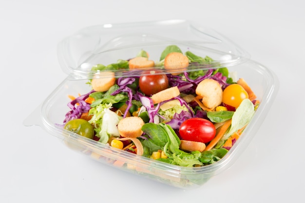 Premium Photo | Close up of take away bowl with fast food salad