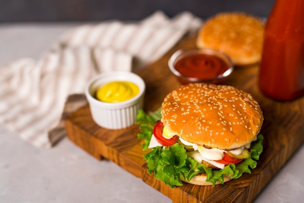 Free Photo | Close-up tasty burgers with mustard and ketchup