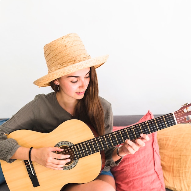 Free Photo Close Up Of A Teenage Girl Wearing Hat Playing Guitar