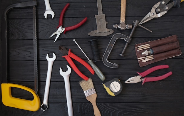 Premium Photo | Close up tools on a wooden background