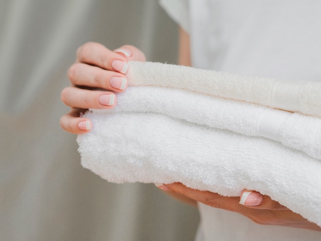 Free Photo | Close up of towels held in hands