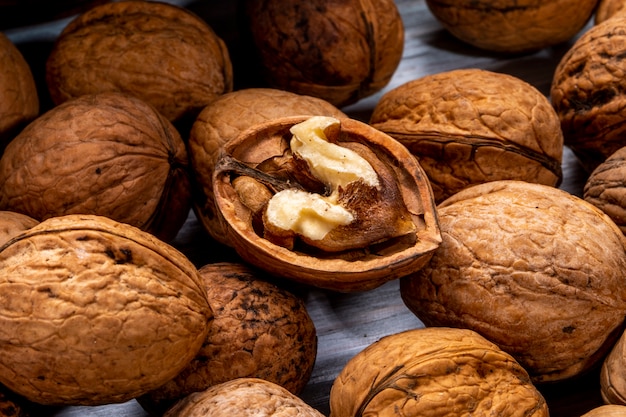 Free Photo | Close up view of walnuts closed and broken scattered on a ...