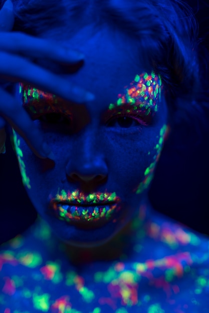 Free Photo | Close-up view of woman with fluorescent make-up