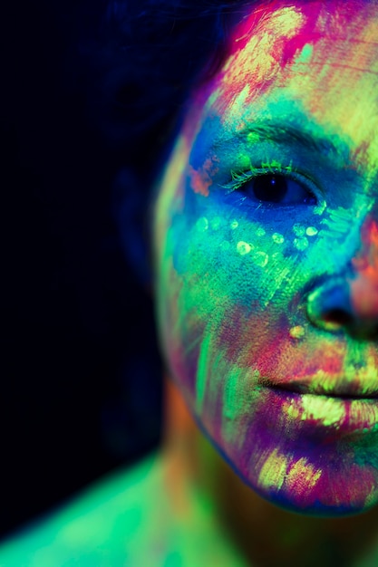 Free Photo | Close-up view of woman with fluorescent make-up