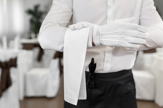 Premium Photo | Close-up of the waiter's hand with a towel.