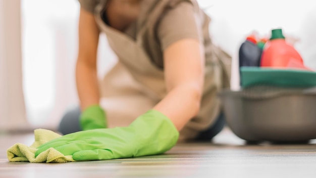 Close-up woman cleaning floor Free Photo