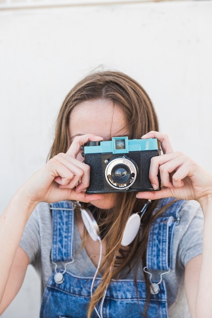 Free Photo | Close-up of a woman clicking photograph with camera