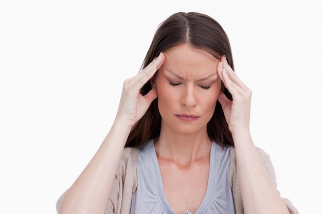 Premium Photo | Close up of woman experiencing a headache