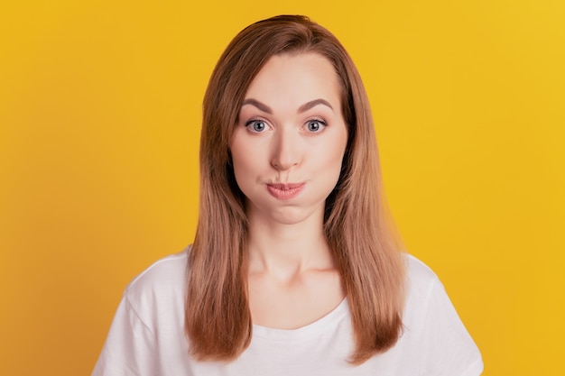 Premium Photo | Close-up of a woman funny face puffed cheeks inflate ...