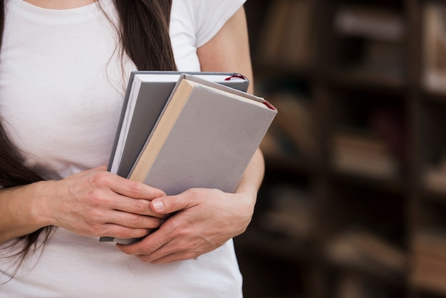 Free Photo | Close-up woman holding books in her hands