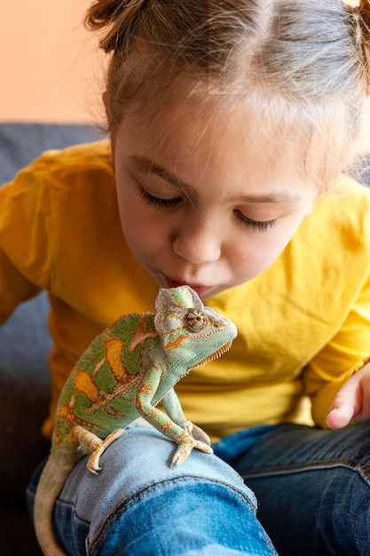 Free Photo | Close up woman kissing chameleon