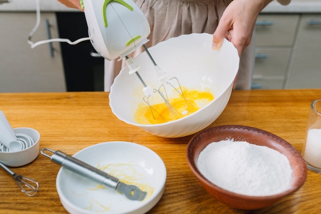 Premium Photo | Close-up of a woman mixing egg in bowl