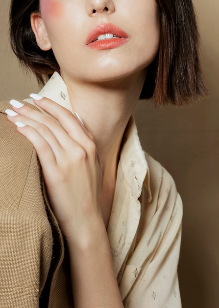 Close-up of woman posing with hand Free Photo