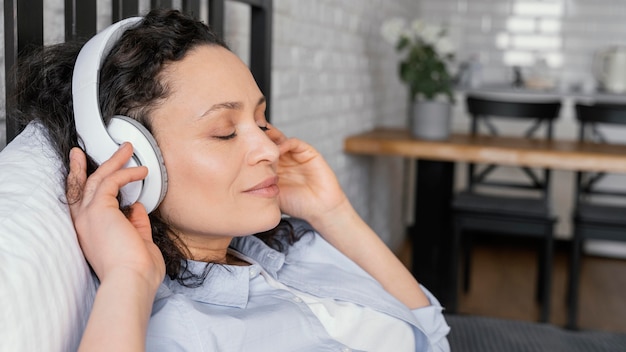 Premium Photo | Close up woman relaxing with headphones