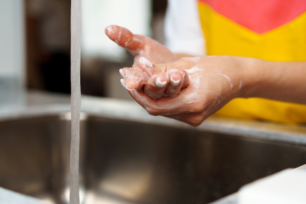 washing hands in kitchen sink or bathroom sink