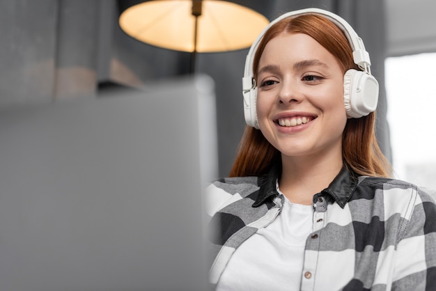 Free Photo | Close up woman wearing headphones