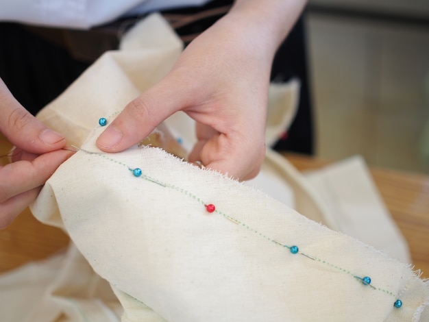 Close up women's hand sewing Photo | Premium Download